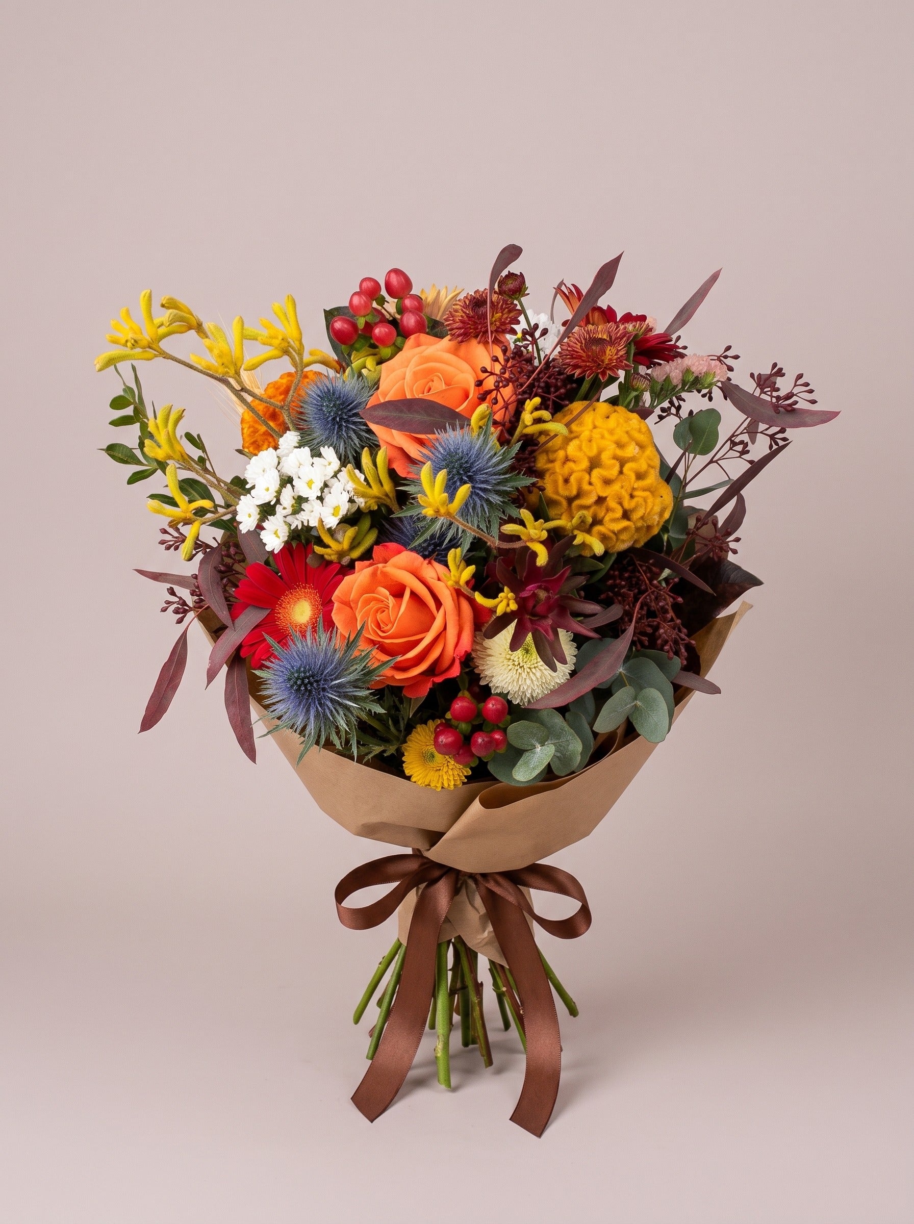 Bouquet di laurea Torino autunnale con rose arancio e celosia gialla