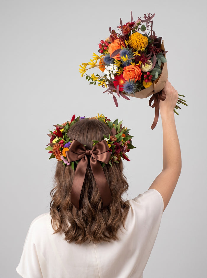 Set laurea Torino autunnale: corona fiorita e bouquet con rose arancio